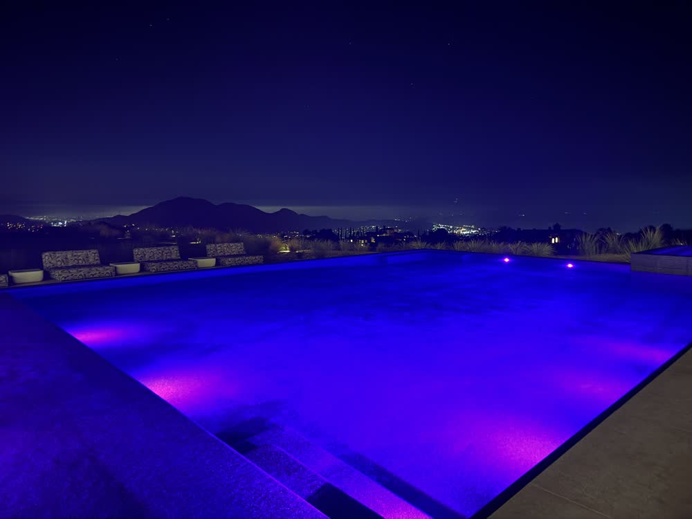 Pool lit with colour LED lighting at night